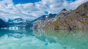 Glacier Bay National Park is a 3.3 million acre wilderness area in Alaska, featuring glaciers, snow-capped mountains, fjords, and a variety of wildlife. Come explore this majestic landscape!