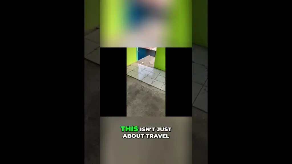 Video frame with a large black 'T' cutout over a blurred green background and the caption 'THIS ISN'T JUST ABOUT TRAVEL'.