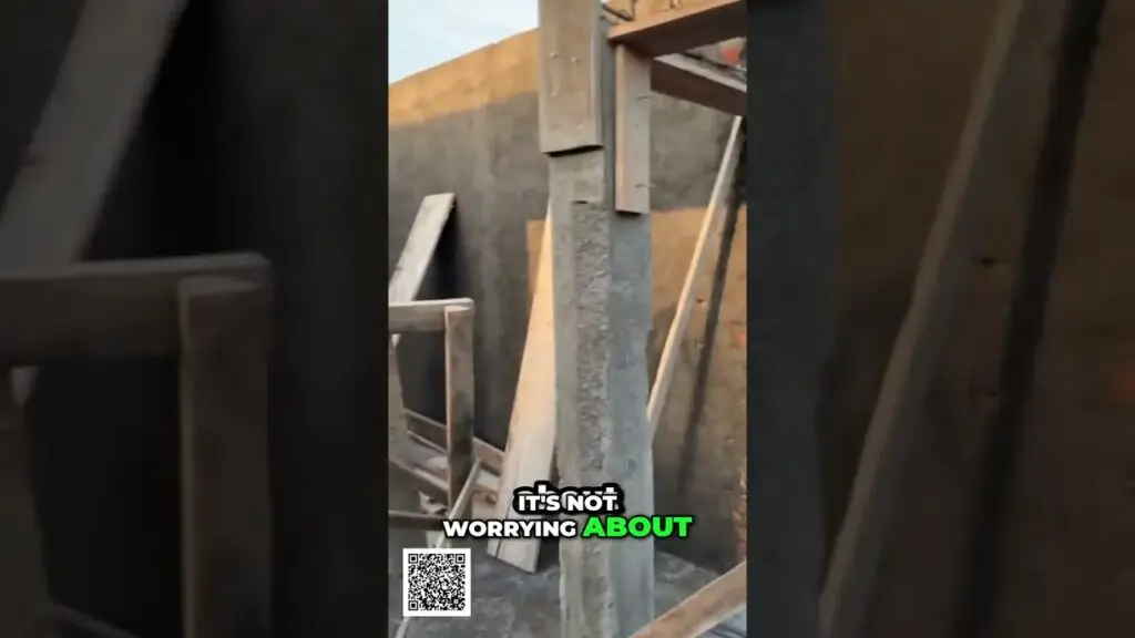 Build Your System Achieve Real Freedom Independence shorts - Travel With Glen Construction site interior with wooden beams and scaffolding; caption reads 'It's not worrying about' with 'ABOUT' in green, and a QR code visible in the corner.