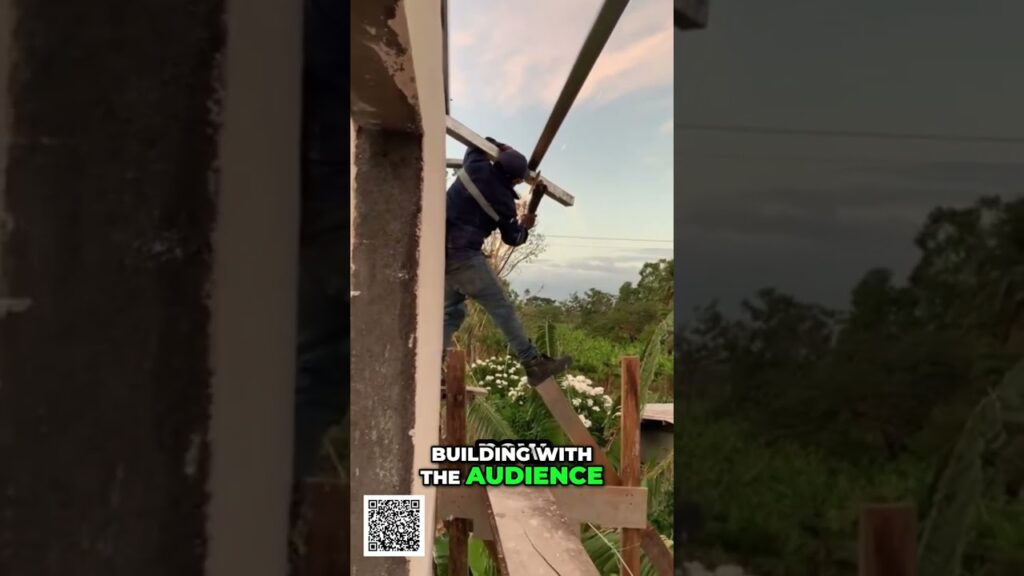 Global Business Build Anywhere Sell Everywhere Earn More shorts - Travel With Glen Person on a wooden beam outdoors, working on a roof frame with a tool; rural garden backdrop and a QR code visible in the corner, plus the overlay text 'BUILDING WITH THE AUDIENCE'