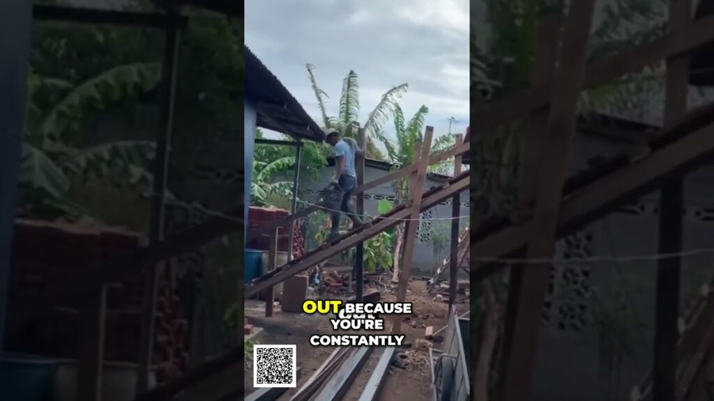 Person standing on a wooden staircase in a cluttered yard with banana trees behind, construction debris around, and a QR code at the bottom; caption reads: “OUTBECAUSE YOU'RE CONSTANTLY” (incomplete text).