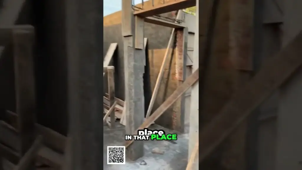 Construction frame with wooden beams and brick walls under construction; caption shows 'place IN THAT PLACE' with a QR code.