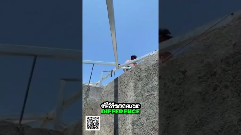 Turn Your Life into Content Income The Secret Ecosystem shorts - Travel With Glen Worker standing on a rooftop behind a concrete wall with metal framework against a blue sky; caption reads 'That’s a huge difference' with a QR code in the corner