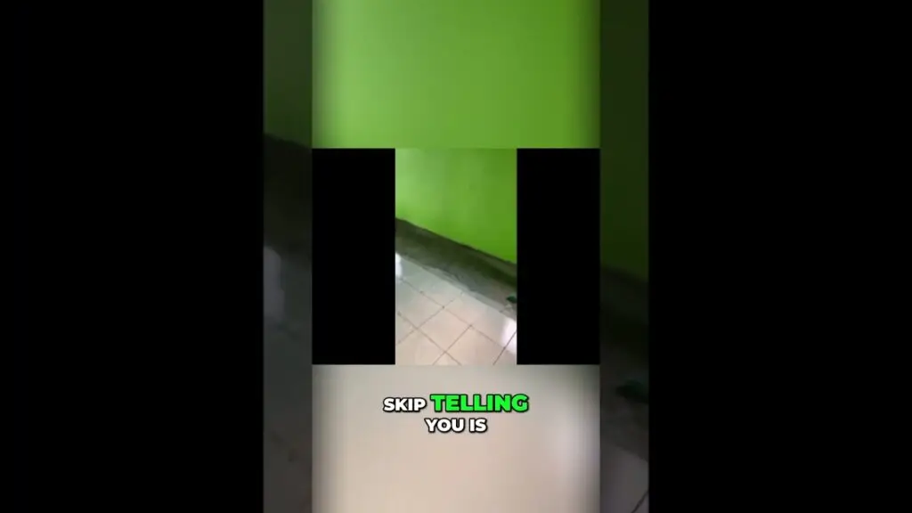 Video frame showing a bright green wall and tiled floor with black vertical bars and a bold caption at the bottom reading 'SKIP TELLING YOU IS' (meme-style overlay).