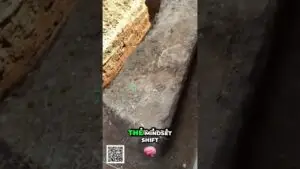 Vertical video still of a dirt trench with a 'THE MINDSET SHIFT' overlay, a pink brain emoji, and a QR code in the corner.