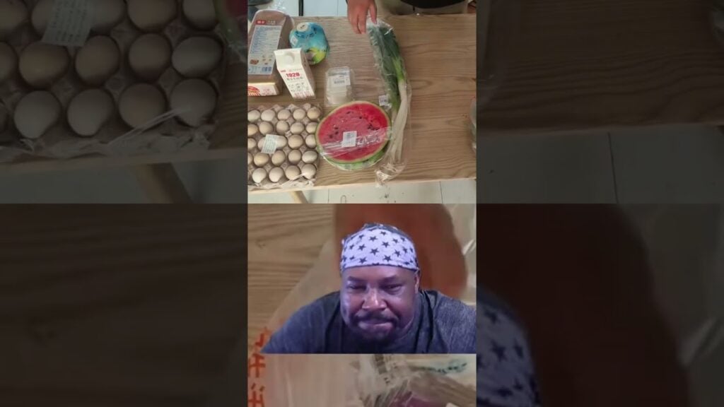 Collage image: groceries on a wooden table (eggs, milk, watermelon slices, vegetables) with a man wearing a star-pattern bandana in a video-frame panel below.